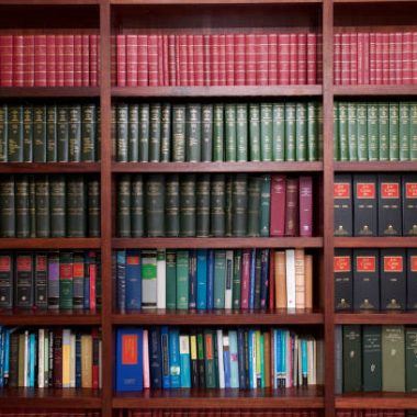 A bookshelf containing volumes of books about Irish Law.