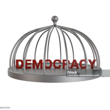 Red 3D word DEMOCRACY trapped in a silver cage. Symbolizing political restriction, censorship, and the suppression of freedom and human rights in a country